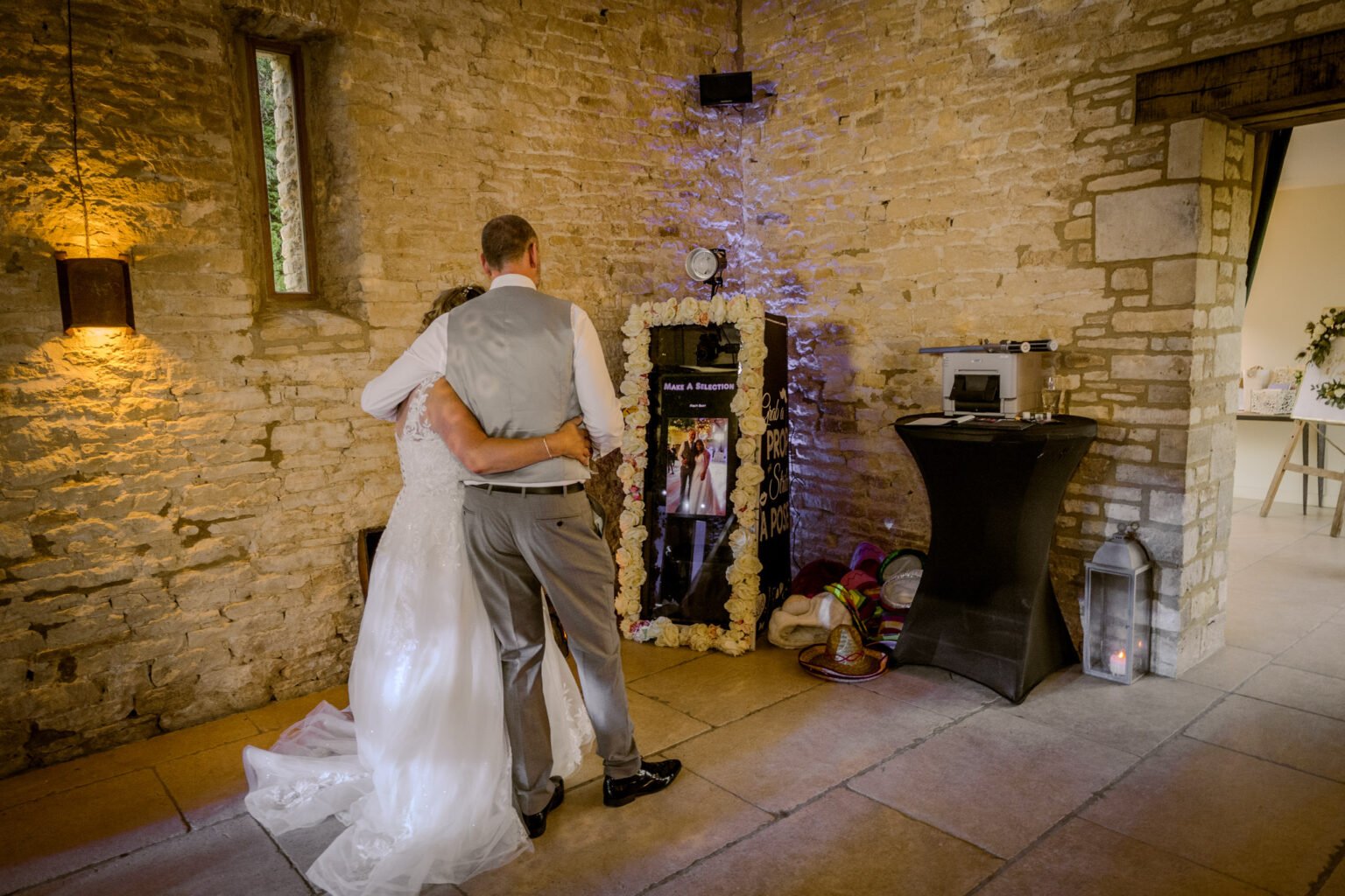 couple posing for mirror booth